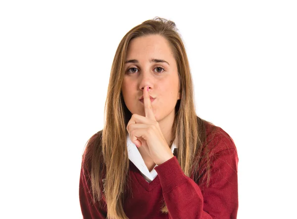 Student making silence gesture over isolated white background — Stock Photo, Image
