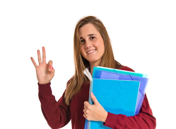 Estudante fazendo Ok sinal sobre fundo branco — Fotografia de Stock