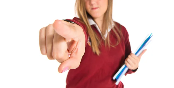 Student pointing to the front over white background — Stock Photo, Image