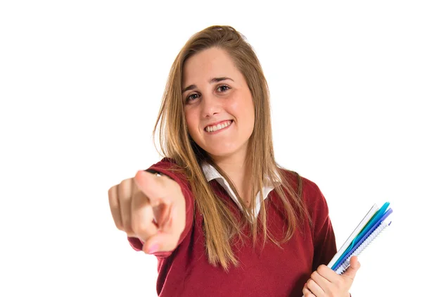 Estudiante apuntando al frente sobre fondo blanco —  Fotos de Stock