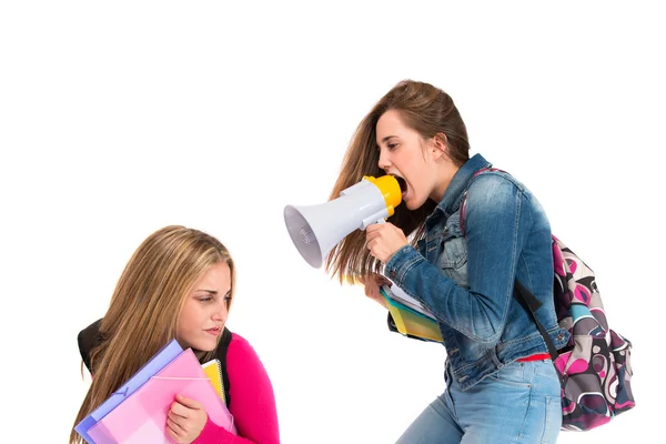 Student shouting at her friends over white background — Stock Photo, Image