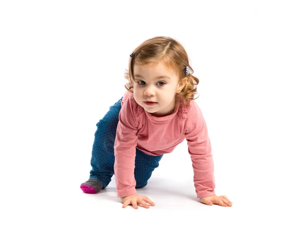 Little girl crawling over white background — Stock Photo, Image