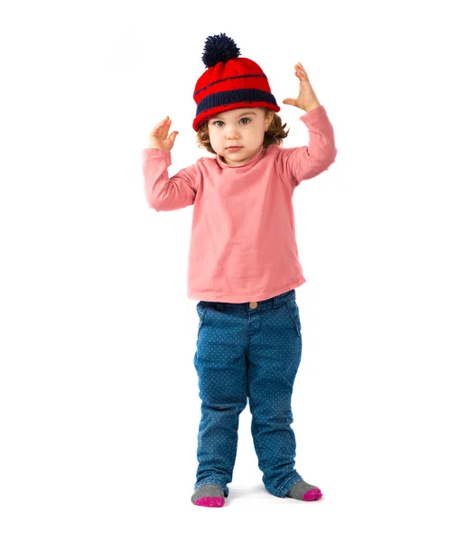 Niña poniéndose un sombrero de Navidad sobre fondo blanco —  Fotos de Stock