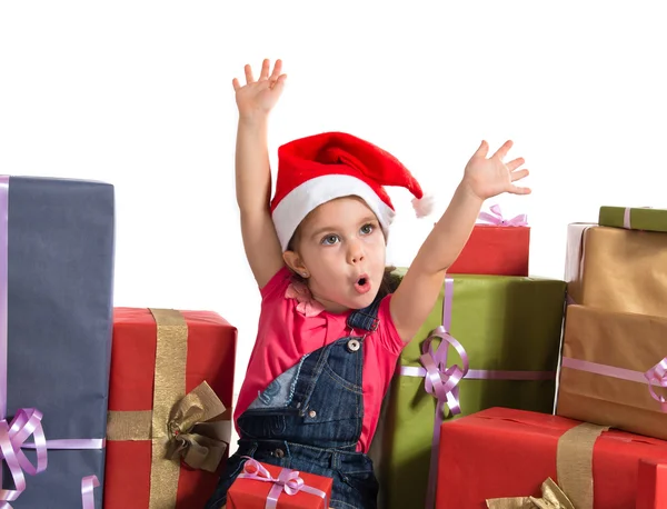 Blonde christmas kid around several presents — Stock Photo, Image