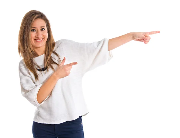 Mujer señalando hacia el lateral — Foto de Stock