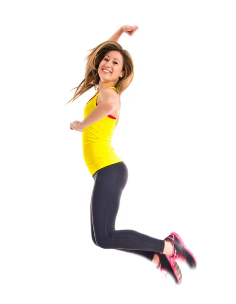 Sport woman jumping over white background — Stock Photo, Image