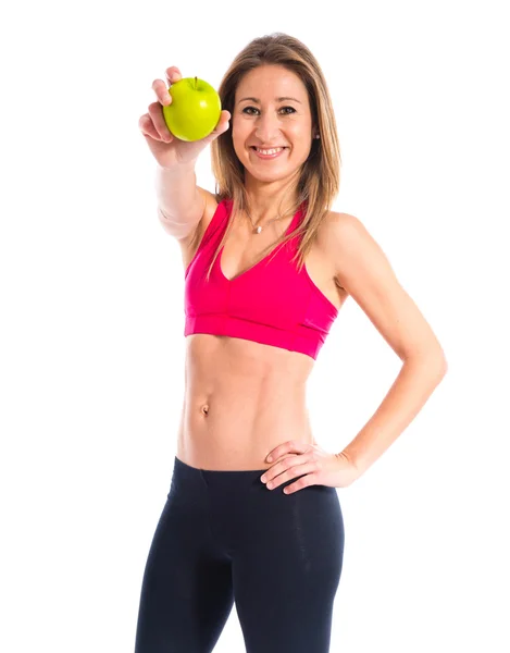 Esporte mulher segurando uma maçã — Fotografia de Stock