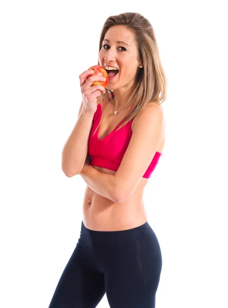 Donna sportiva con una mela in mano — Foto Stock