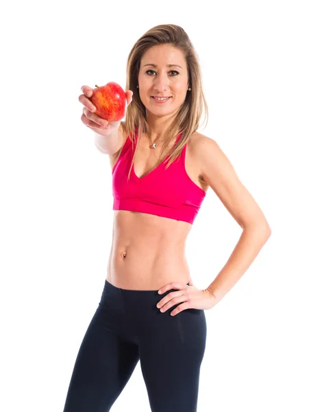 Sport woman holding an apple Stock Picture