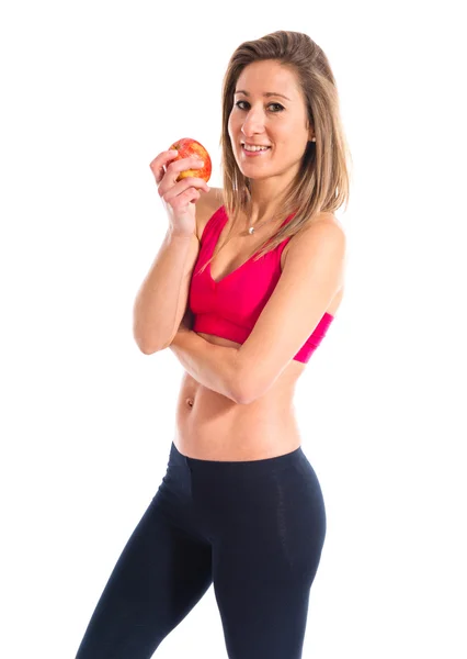 Sport woman holding an apple Stock Picture