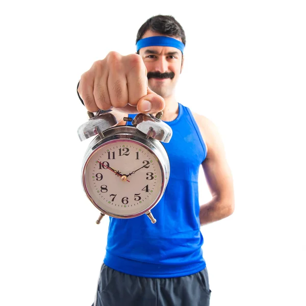 Vintage sportman holding a clock — Stock Photo, Image