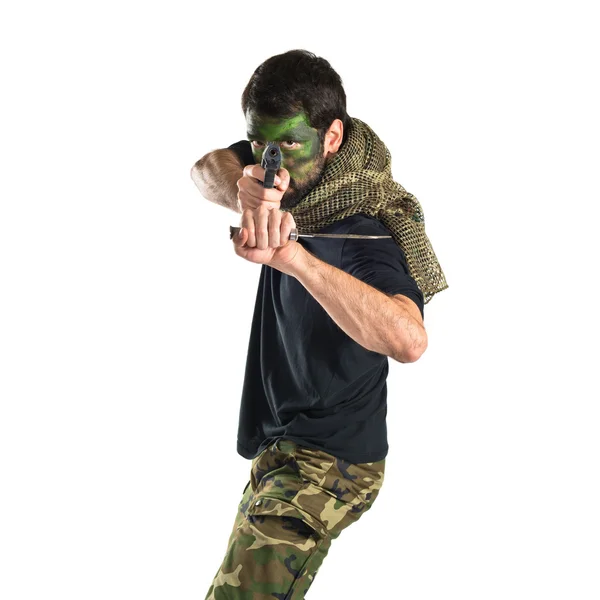 Soldier shooting with a pistol — Stock Photo, Image