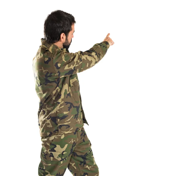 Soldier pointing back — Stock Photo, Image