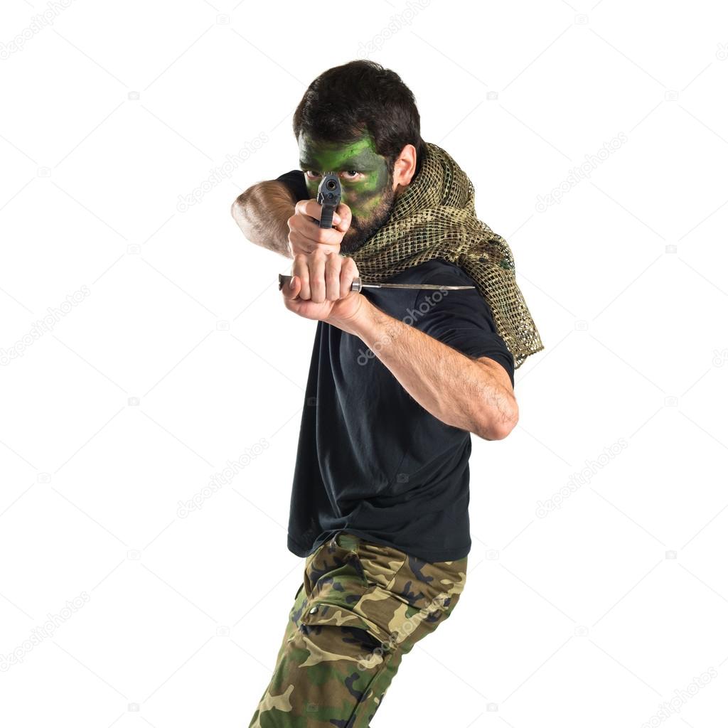 Soldier shooting with a pistol 