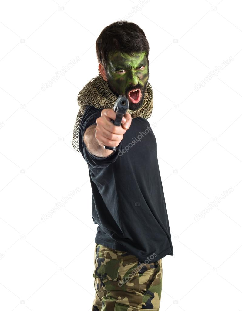 Soldier shooting with a pistol 