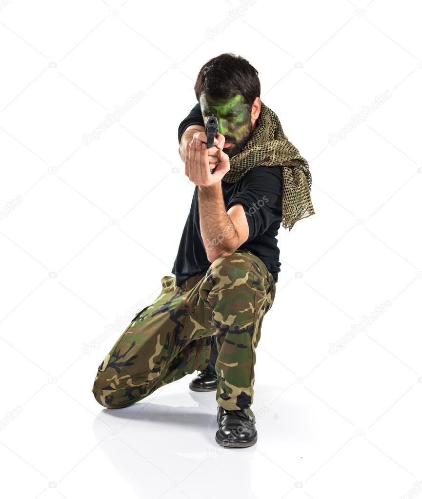 Soldier shooting with a pistol 