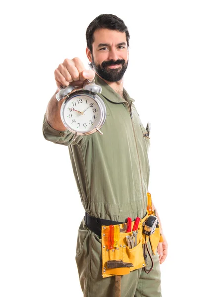 Mechanic holding vintage clock — Stock Photo, Image