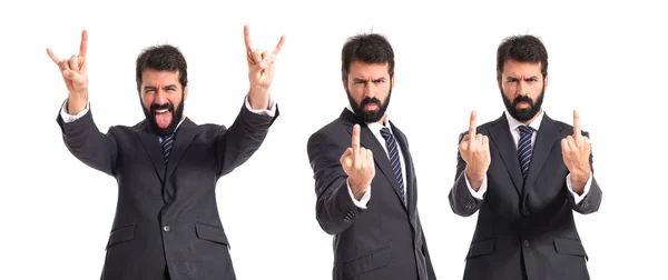 Biznesmen podejmowania gest róg na białym tle — Zdjęcie stockowe