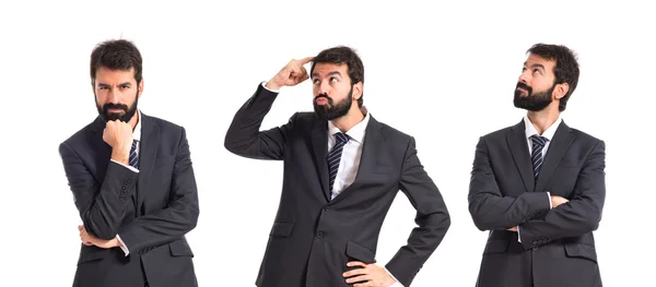 Businessman thinking over isolated white background — Stock Photo, Image