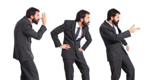 Businessman doing a joke over isolated white background — Stock Photo, Image