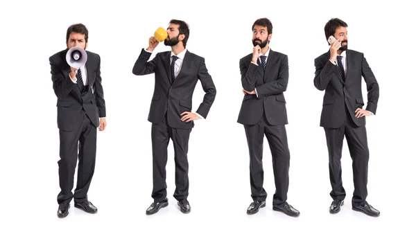 Businessman holding a cup of coffee over white background — Stock Photo, Image