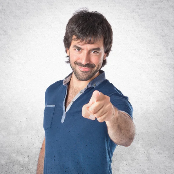 Man pointing to the front over white background — Stock Photo, Image