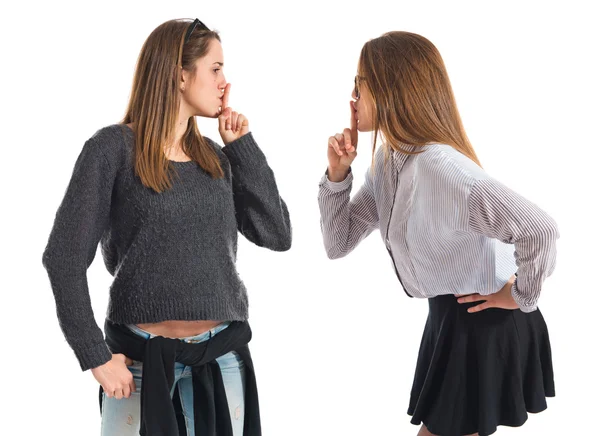 Twin sisters making silence gesture — Stock Photo, Image