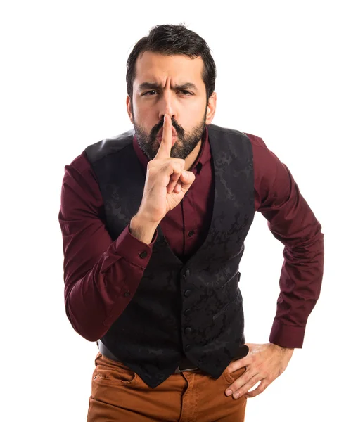 Man wearing waistcoat making silence gesture — Stock Photo, Image