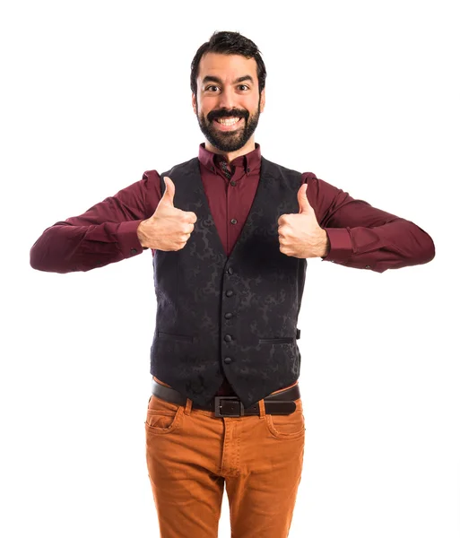 Muž na sobě vestu s palcem nahoru — Stock fotografie