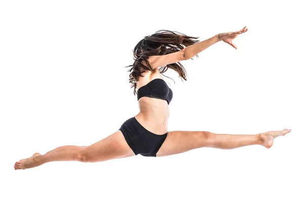 Jovem bailarina de balé pulando sobre fundo branco — Fotografia de Stock