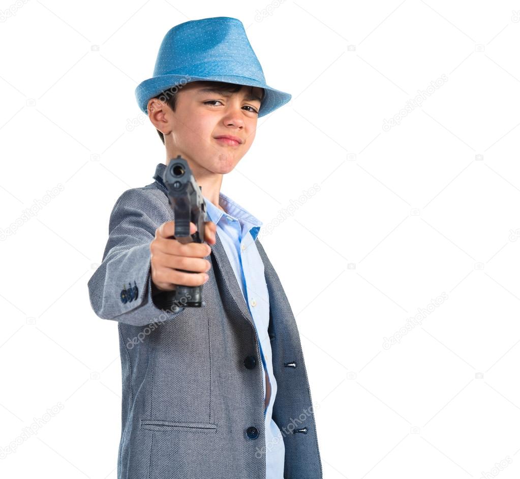 Gangster boy shooting with a pistol 