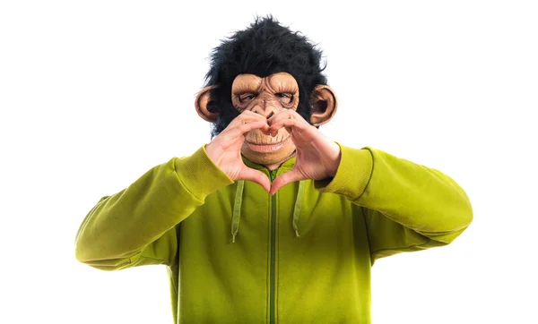 Monkey man making a heart with his hands — Stock Photo, Image