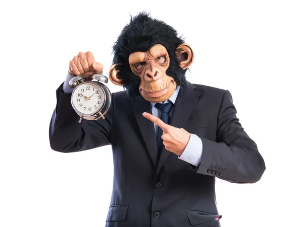 Małpa mężczyzna trzyma vintage zegar — Zdjęcie stockowe