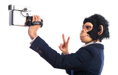 Monkey man with video camera clipart