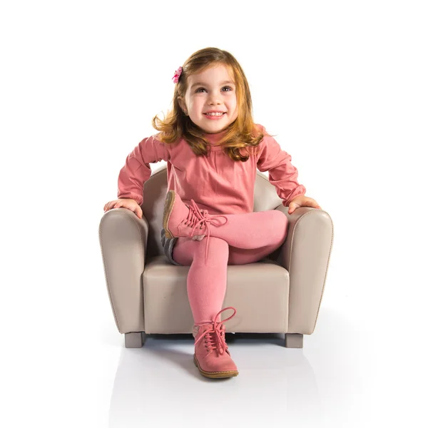 Meisje, zittend op leunstoel — Stockfoto