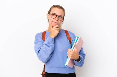 Young student caucasian woman isolated on white background having doubts and thinking