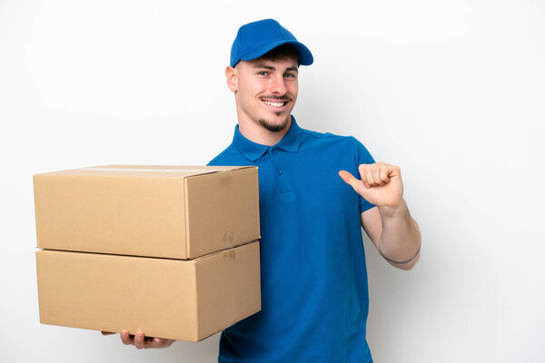 Delivery caucasian man isolated on white background proud and self-satisfied