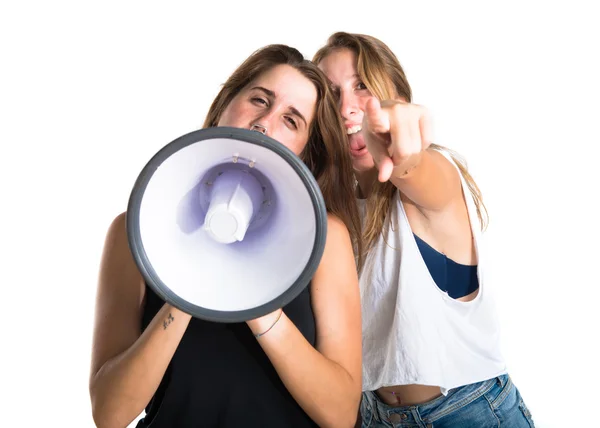 Friends shouting by megaphone — Stock Photo, Image