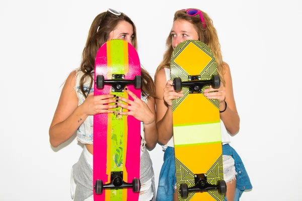 Two friends hiding behind their skateboards — Stock Photo, Image