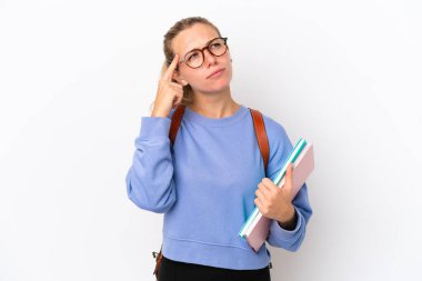 Young student caucasian woman isolated on white background having doubts and thinking