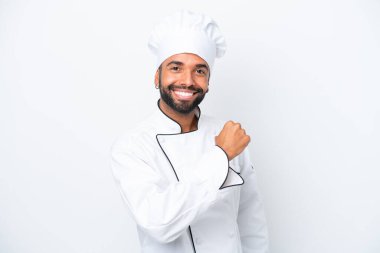 Young Brazilian chef man isolated on white background celebrating a victory