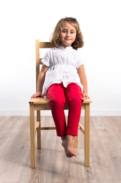 Girl on chair — Stock Photo, Image