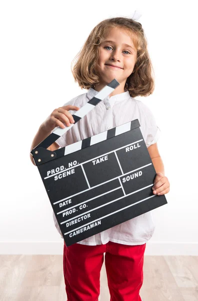 Girl holding a clapperboard — Stock Photo, Image