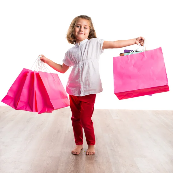 Menina com muitos sacos de compras — Fotografia de Stock