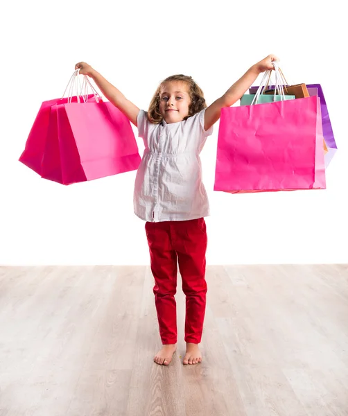 Lány sok bevásárló táskák — Stock Fotó