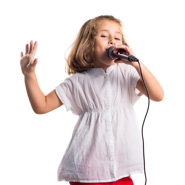 Girl singing with microphone — Stock Photo, Image