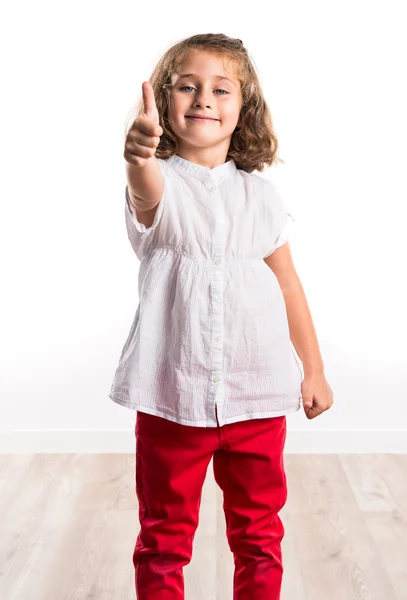 Chica con el pulgar hacia arriba — Foto de Stock