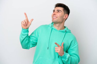 Young caucasian man isolated on white background pointing with the index finger a great idea