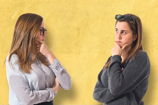 Twin sisters thinking — Stock Photo, Image