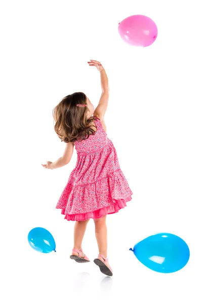 Flicka leker med ballonger — Stockfoto
